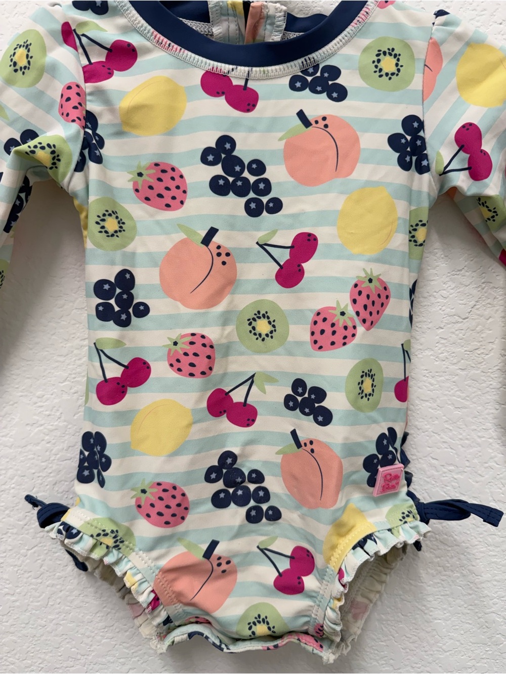 Ruffle Butts Navy-Trim Fruit Print Long Sleeve One-Piece - Picture 3 of 7